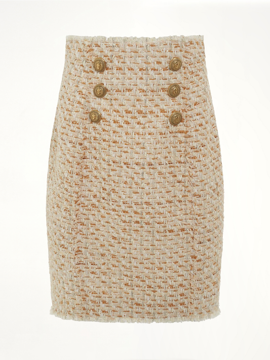 Image of a model wearing Skirts. Productname: BALMAIN High Waisted 6 Button Tweed Short Skirt in BEIGE colour by brand - BALMAIN