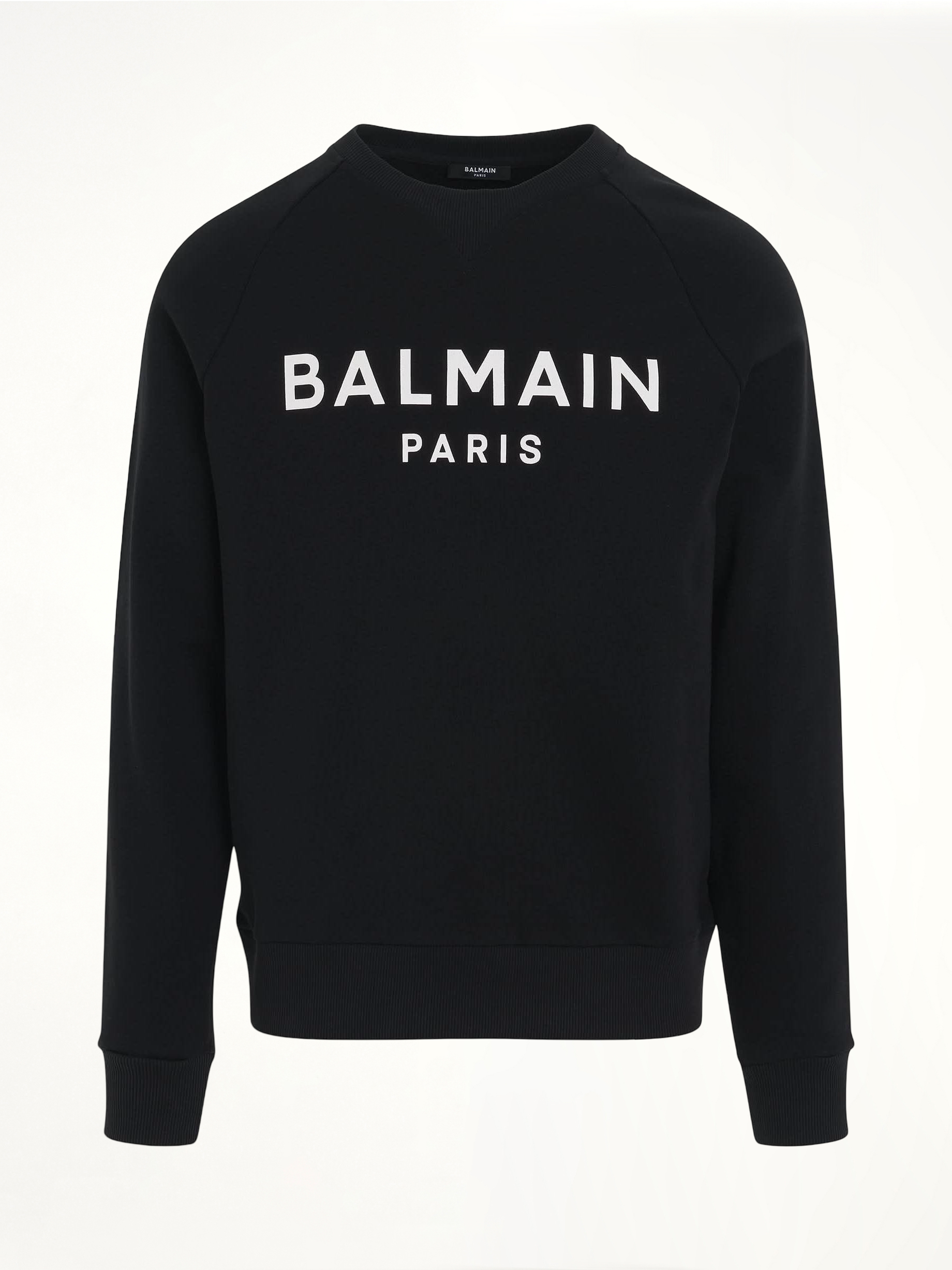 Image of a model wearing Outerwear. Productname: BALMAIN Classic Logo Print Sweatshirt in Black colour by brand - BALMAIN