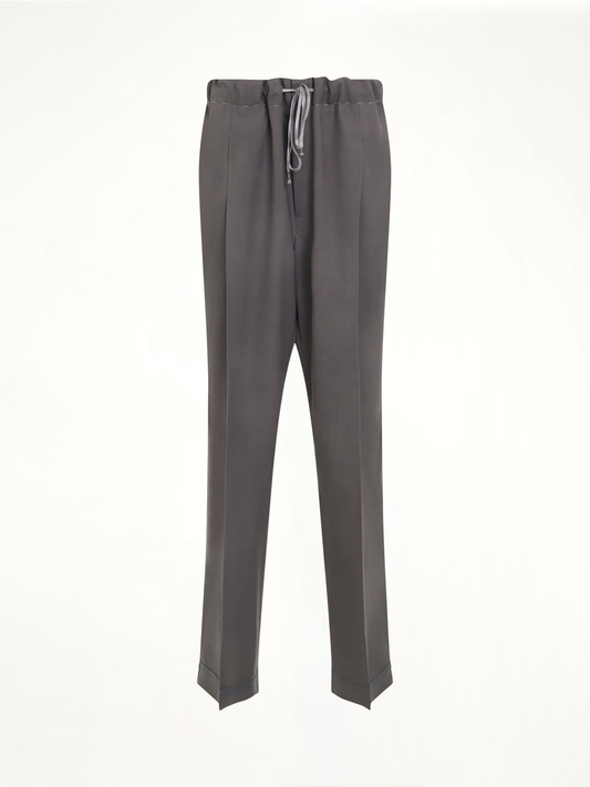 Image of a model wearing Pants. Productname: MAISON MARGIELA Wool Trousers in GREY colour by brand - MAISON MARGIELA