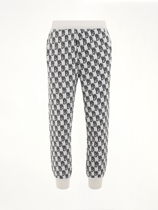 Image of a model wearing Pants. Productname: WE11DONE Logo Knit Jacquard Trouser in White colour by brand - WE11DONE