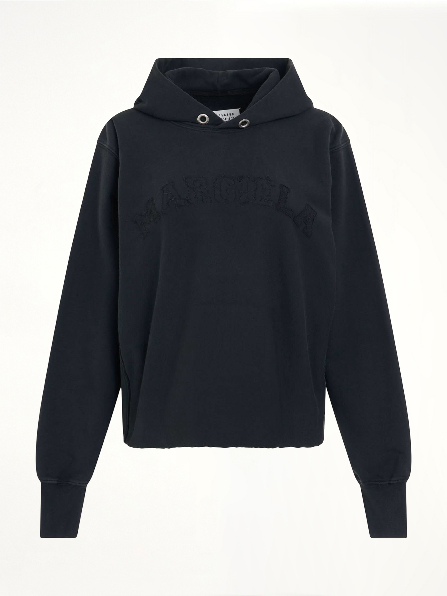 Image of a model wearing Outerwear. Productname: MAISON MARGIELA Memory Logo Hoodie in BLACK colour by brand - MAISON MARGIELA
