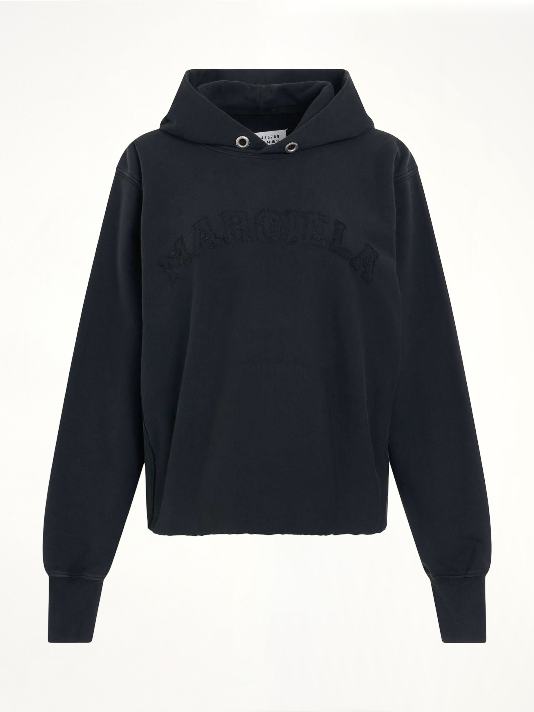 Image of a model wearing Outerwear. Productname: MAISON MARGIELA Memory Logo Hoodie in BLACK colour by brand - MAISON MARGIELA