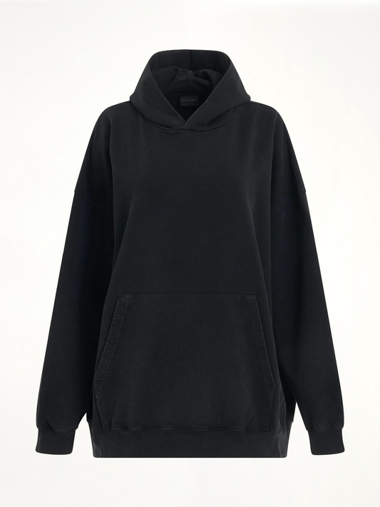 Image of a model wearing Outerwear. Productname: BALENCIAGA Back Logo Oversized Hoodie in BLACK colour by brand - BALENCIAGA