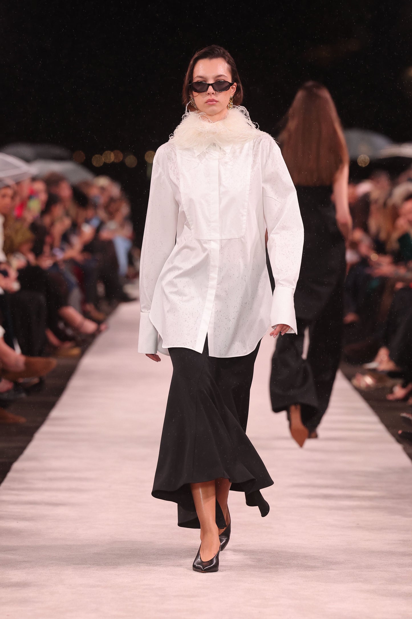 Image of a model wearing Tops. Product name - White Cotton Shirting Bib Front Shirt in White colour by brand - Carla Zampatti