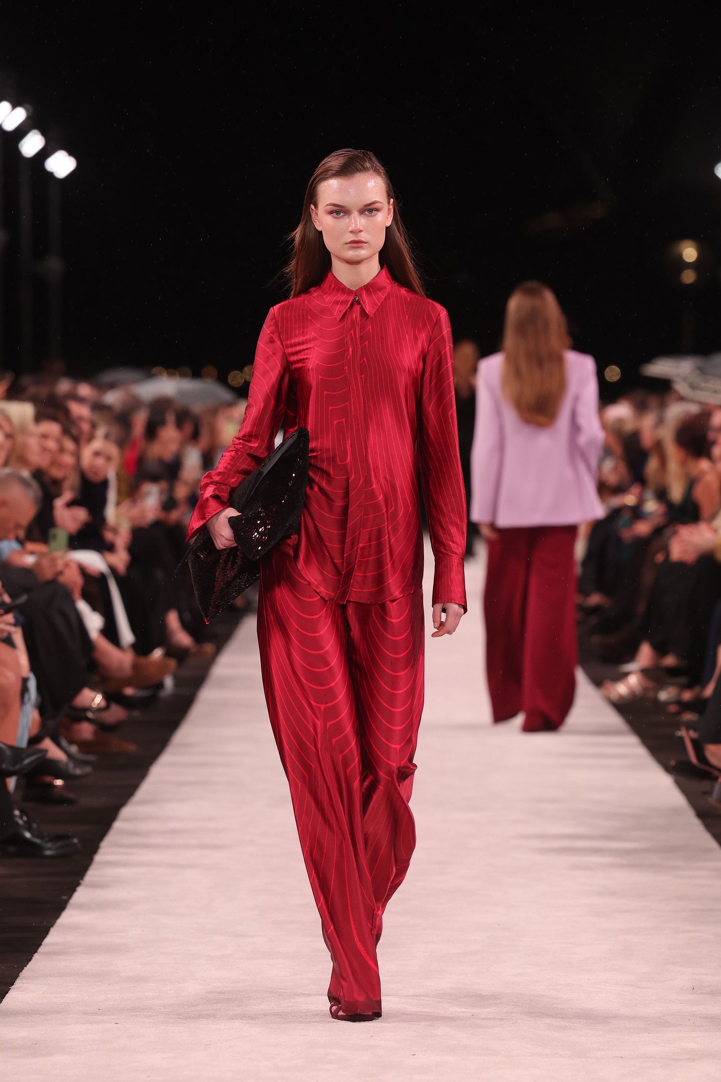 Image of a model wearing Tops. Product name - Undercurrent Silk Viscose Stretch Classic Blouse in Red colour by brand - Carla Zampatti