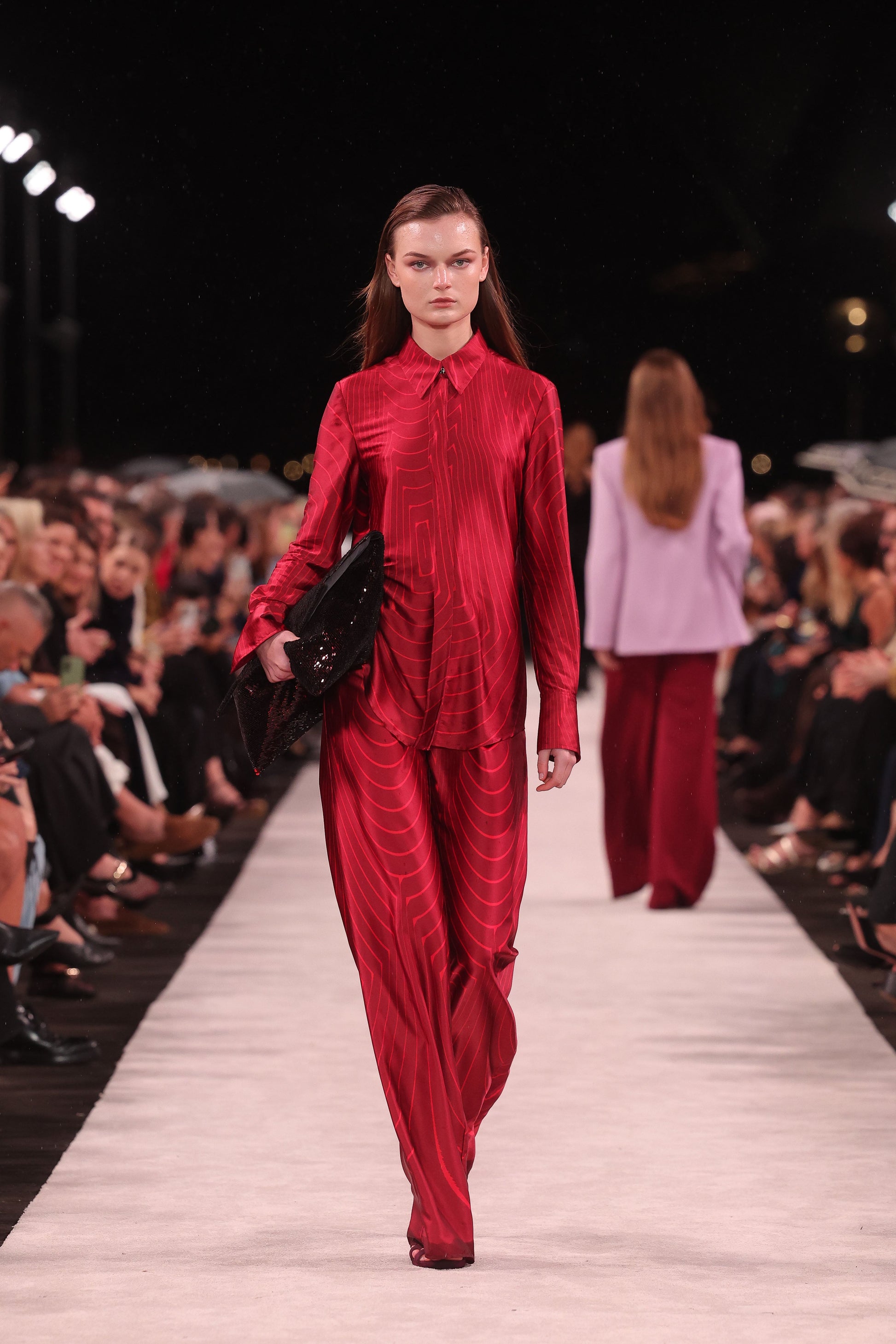Image of a model wearing Tops. Product name - Undercurrent Silk Viscose Stretch Classic Blouse in Red colour by brand - Carla Zampatti