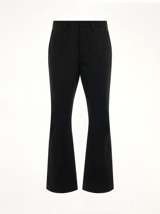 Image of a model wearing Pants. Product name - Chino Kick Flare Pants in Black colour by brand - AMIRI