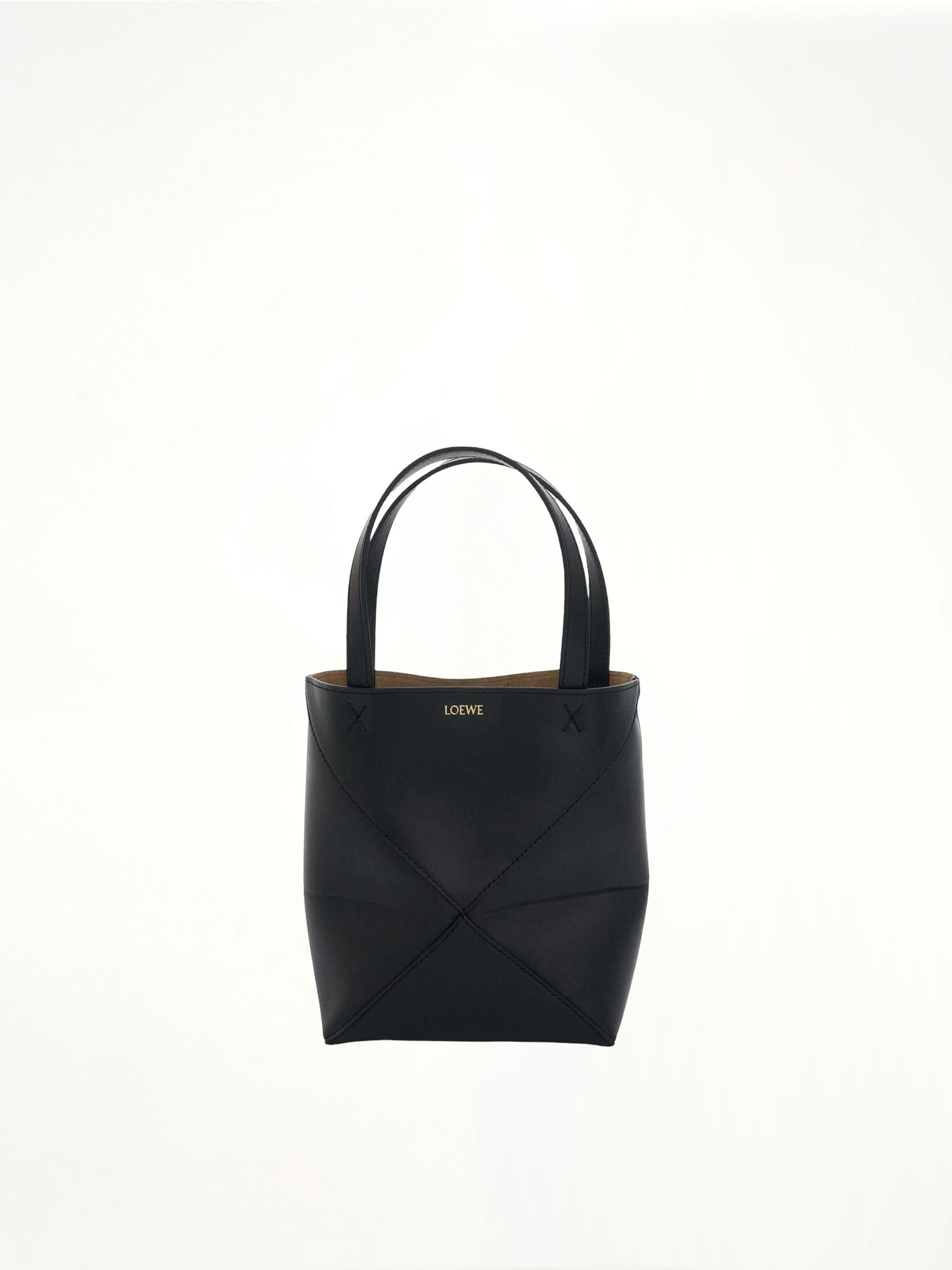 Image of Bags. Product name - Mini Fold Puzzle Tote Bag in Black colour by brand - LOEWE
