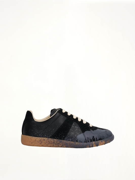 Image of Sneakers. Productname: MAISON MARGIELA Replica Paint Splatter Sneaker in BLACK colour by brand - MAISON MARGIELA