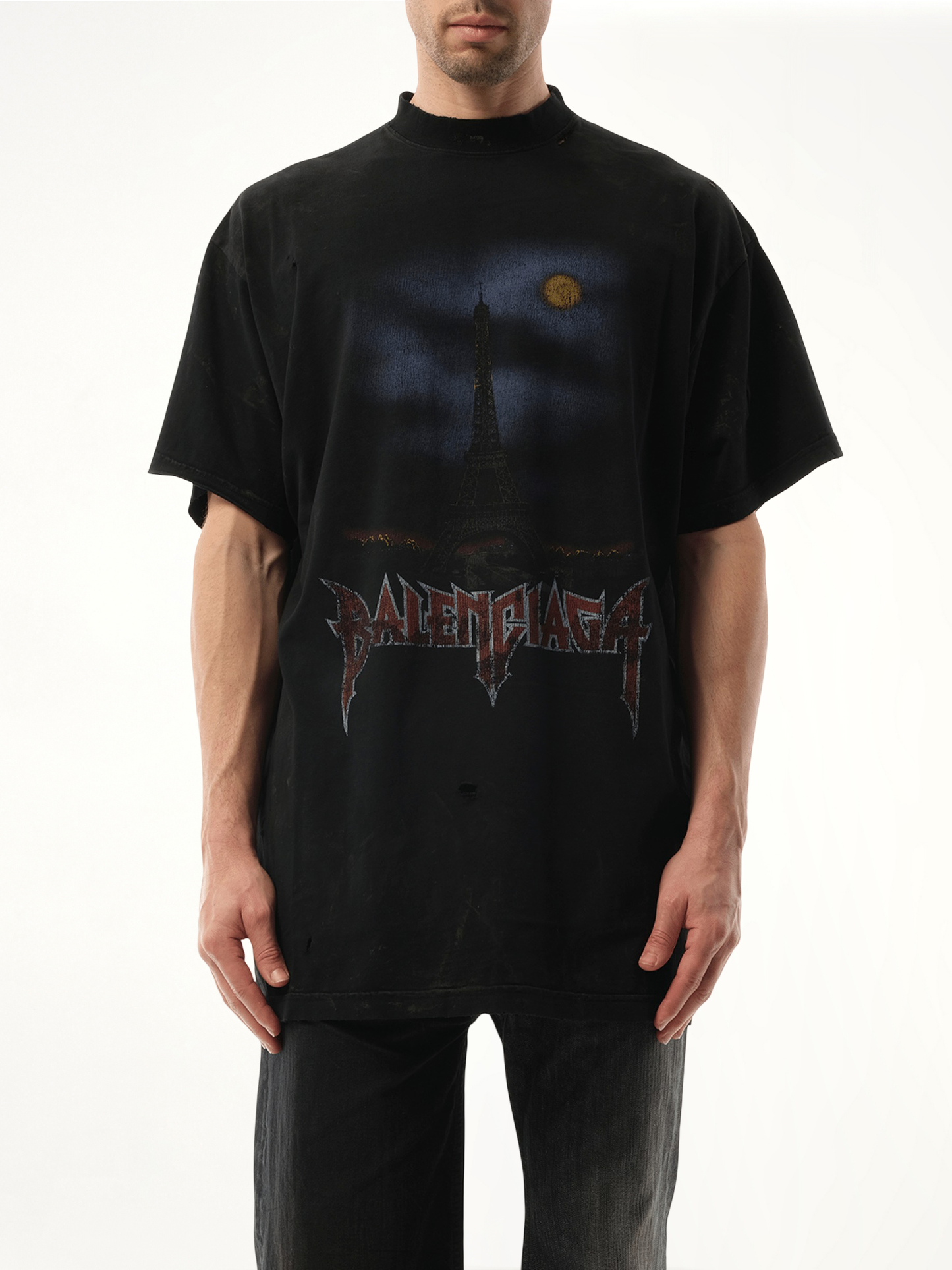 Image of a model wearing Tops. Productname: BALENCIAGA Paris Moon Oversized T-Shirt in Black colour by brand - BALENCIAGA