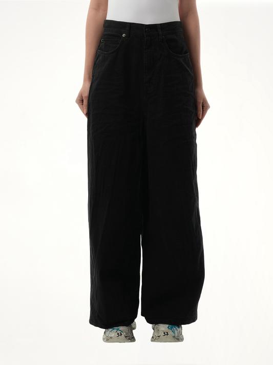 Image of a model wearing Denim. Productname: BALENCIAGA Low Crotch Japanese Denim Jeans in BLACK colour by brand - BALENCIAGA