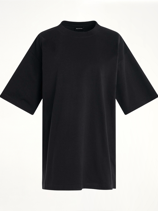 Image of a model wearing Tops. Productname: BALENCIAGA Handwritten Logo T-Shirt in BLACK colour by brand - BALENCIAGA