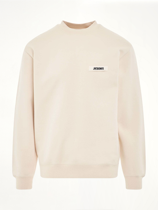 Image of a model wearing Outerwear. Product name - Gros Grain Logo Sweatshirt in Beige colour by brand - JACQUEMUS