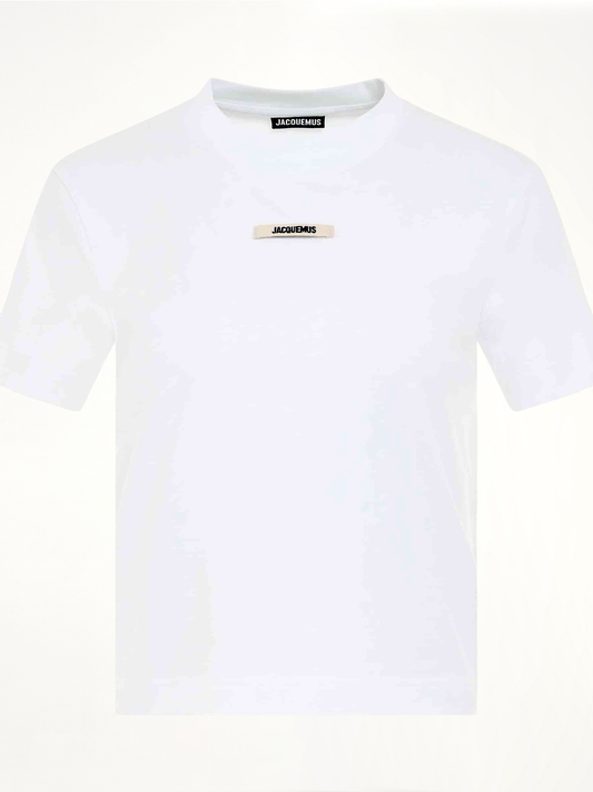 Image of a model wearing Tops. Productname: JACQUEMUS Gros Grain Logo T-Shirt in WHITE colour by brand - JACQUEMUS
