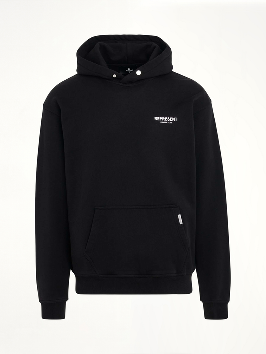 Image of a model wearing Outerwear. Product name - New Represent Owners Club Hoodie in Black colour by brand - REPRESENT