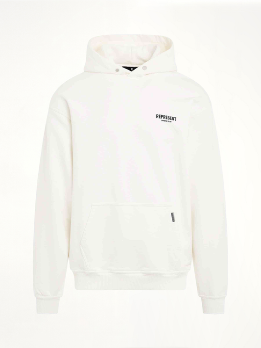 Image of a model wearing Outerwear. Productname: New Represent Owners Club Hoodie in White colour by brand - REPRESENT