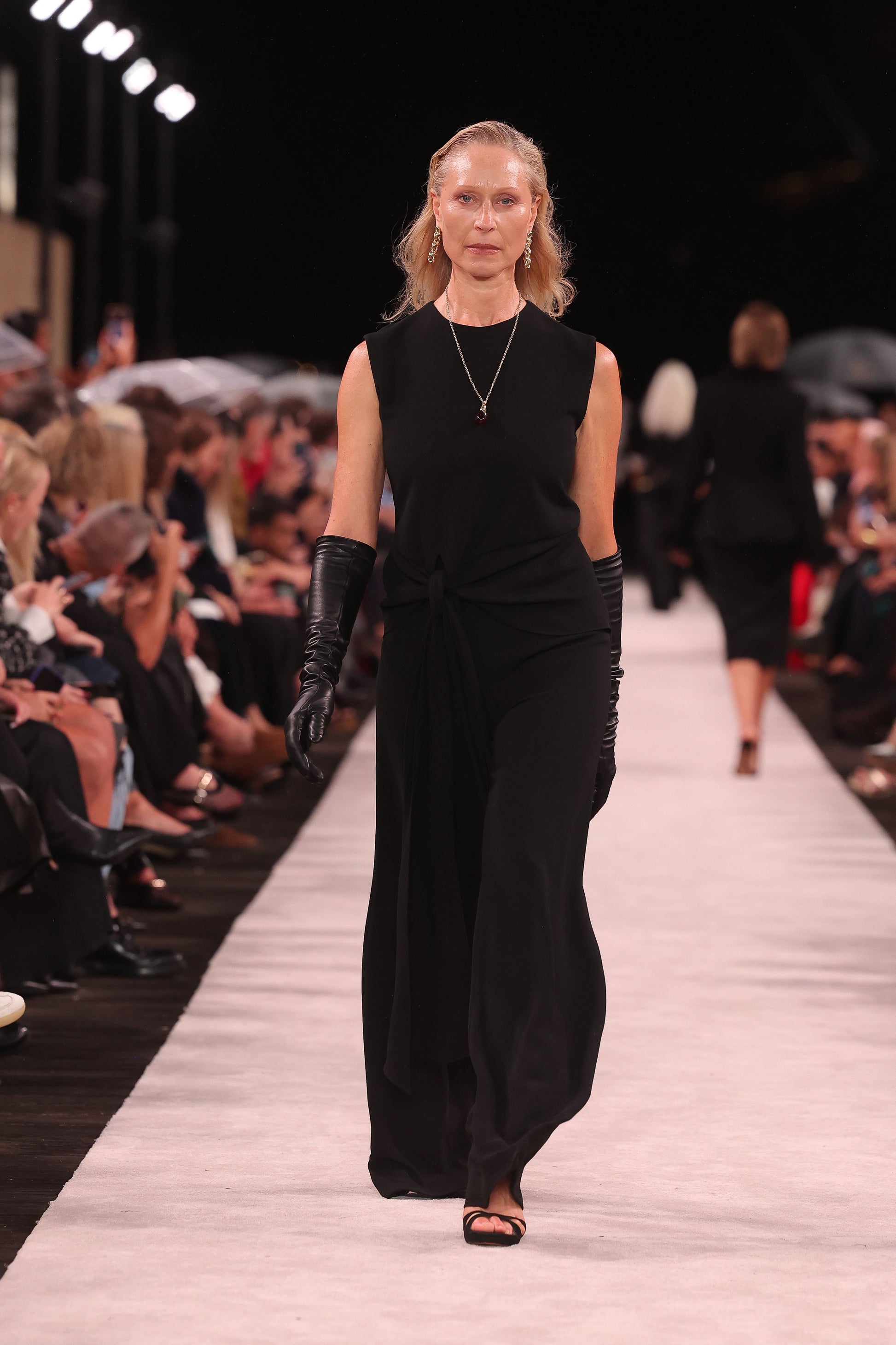 Image of Bodysuits. Product name - Black Crepe Waisted Tie Front Jumpsuit in Black colour by brand - Carla Zampatti