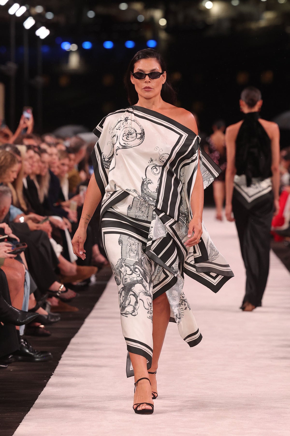 Image of a model wearing Tops. Product name - Rococo Silk Twill Peak Hem Scarf Top in White colour by brand - Carla Zampatti