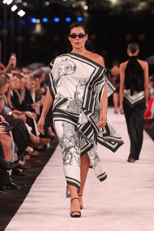 Image of a model wearing Skirts. Product name - Rococo Silk Twill Wrap Midi Skirt in White colour by brand - Carla Zampatti