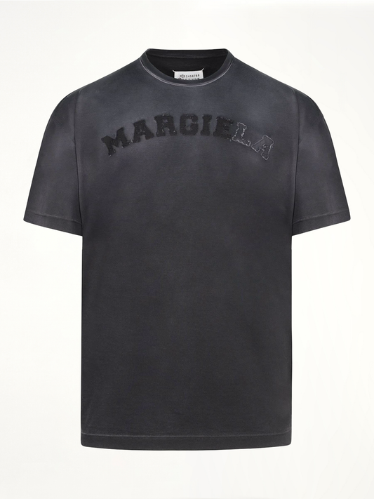 Image of a model wearing Tops. Productname: MAISON MARGIELA Memory Logo T-Shirt in Grey colour by brand - MAISON MARGIELA