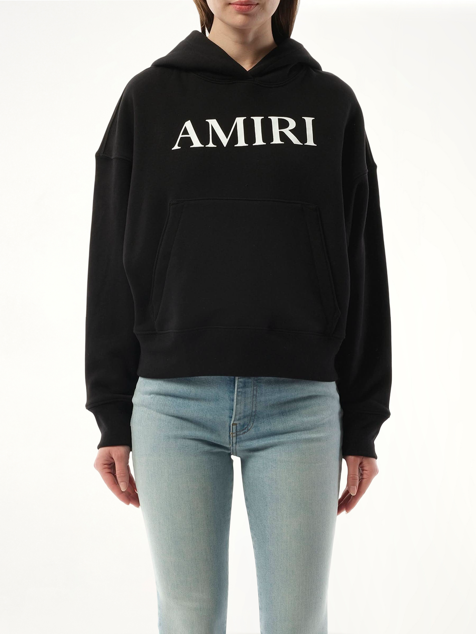 Image of a model wearing Outerwear. Product name - Amiri Core Logo Hoodie in Black colour by brand - AMIRI