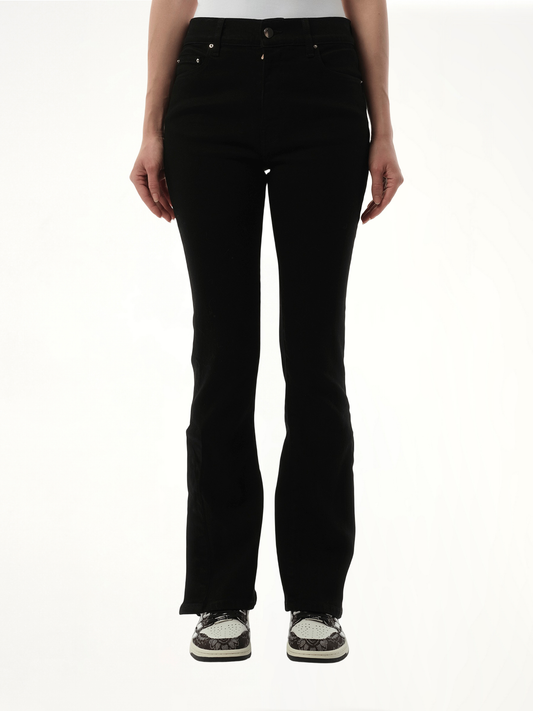 Image of a model wearing Denim. Productname: AMIRI Kick Flare Jeans in BLACK colour by brand - AMIRI
