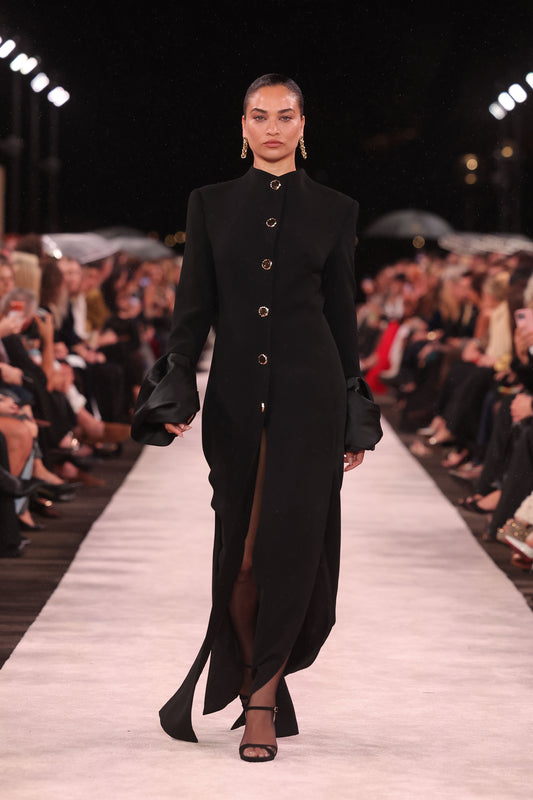 Image of a model wearing Outerwear. Product name - Black Crepe Split Hem Coat in Black colour by brand - Carla Zampatti