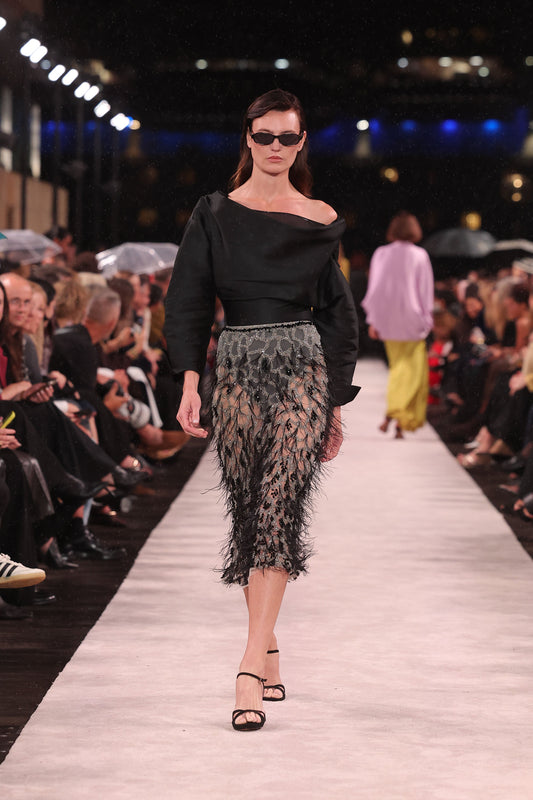 Image of a model wearing Tops. Product name - Black Matte Sateen Scultped Bodysuit in Black colour by brand - Carla Zampatti