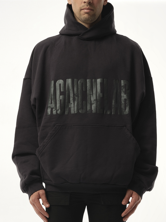 Image of a model wearing Outerwear. Productname: BALENCIAGA AGAICNELAB Large Fit Hoodie in BLACK colour by brand - BALENCIAGA