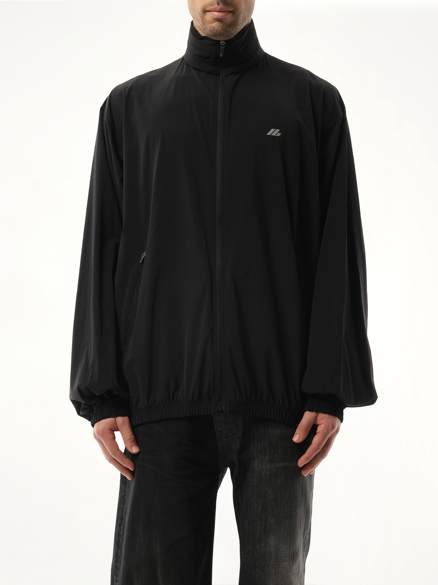 Image of a model wearing Outerwear. Productname: BALENCIAGA Stretch Nylon Windbreaker in Black colour by brand - BALENCIAGA