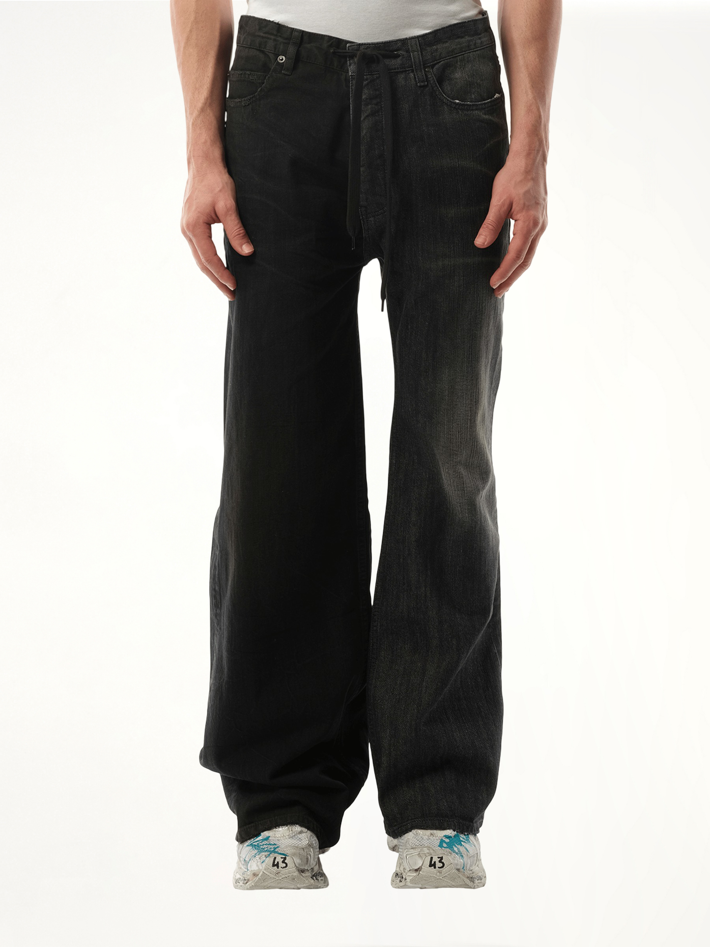 Image of a model wearing Denim. Productname: BALENCIAGA Fifty-Fifty Pants in BLACK colour by brand - BALENCIAGA