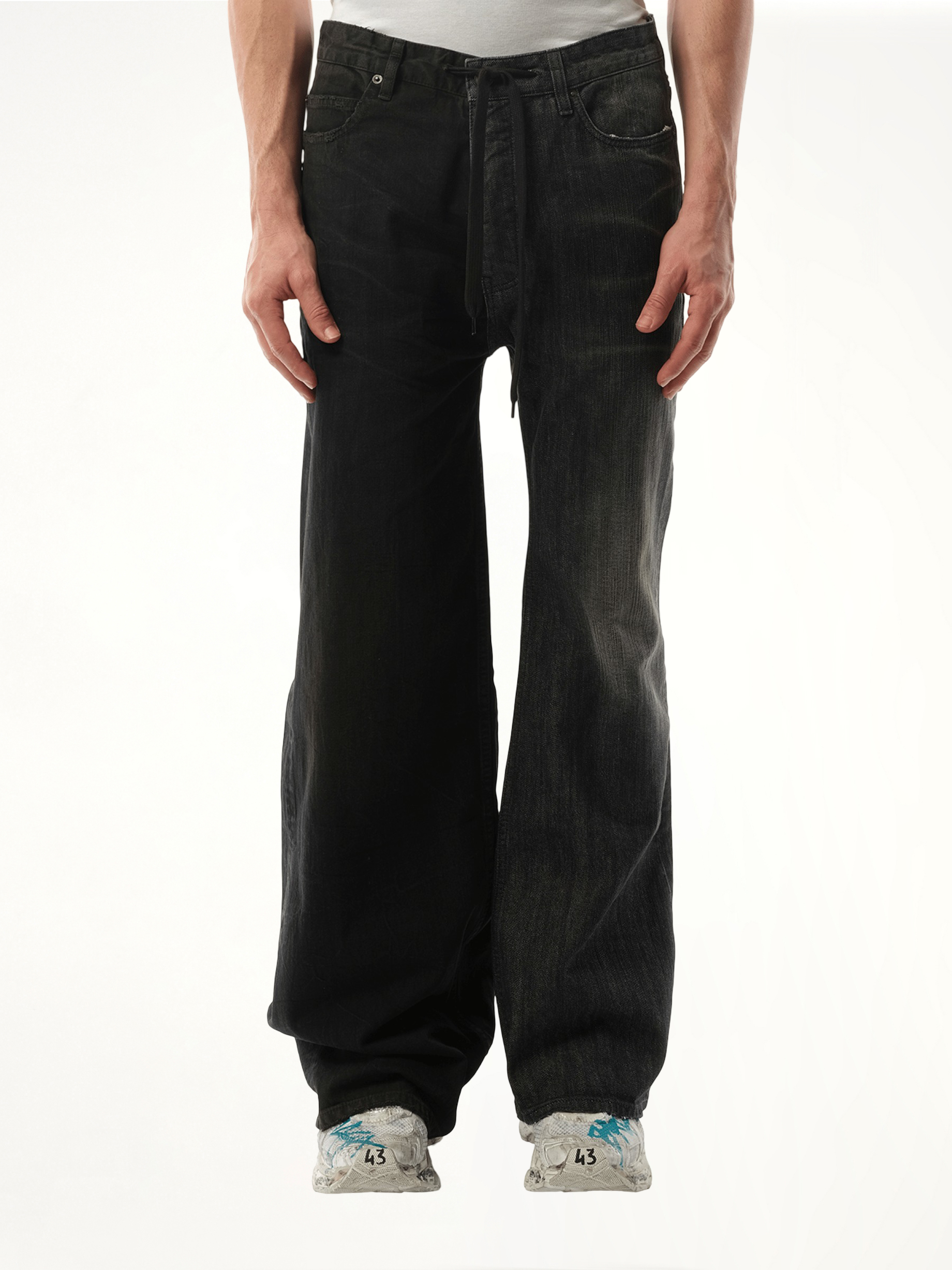 Image of a model wearing Denim. Productname: BALENCIAGA Fifty-Fifty Pants in BLACK colour by brand - BALENCIAGA