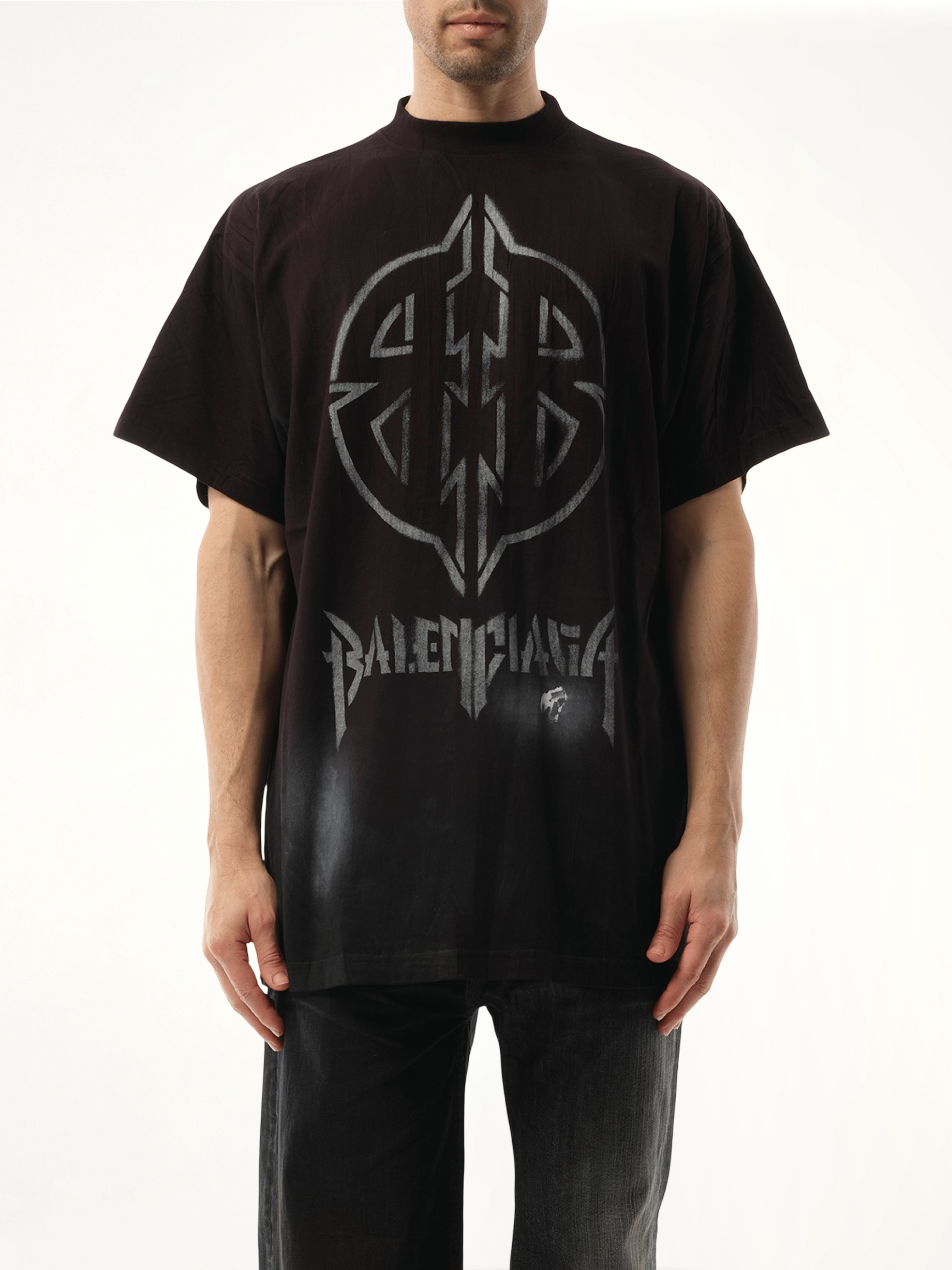 Image of a model wearing Tops. Productname: BALENCIAGA Metal BB Stencil Oversized T-Shirt in BLACK colour by brand - BALENCIAGA