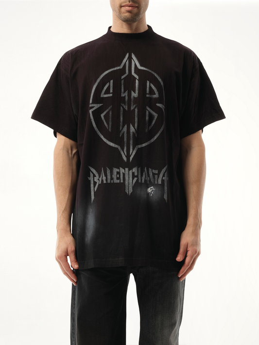 Image of a model wearing Tops. Productname: BALENCIAGA Metal BB Stencil Oversized T-Shirt in BLACK colour by brand - BALENCIAGA