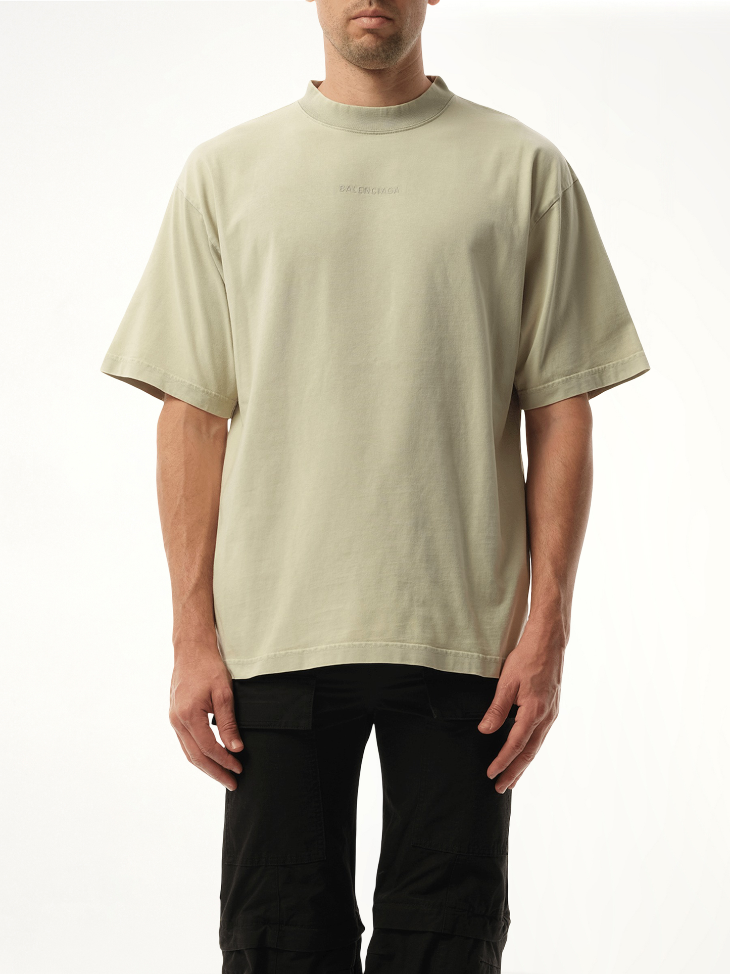 Image of a model wearing Tops. Productname: BALENCIAGA Back Embroidered Medium Fit T-Shirt in Grey colour by brand - BALENCIAGA