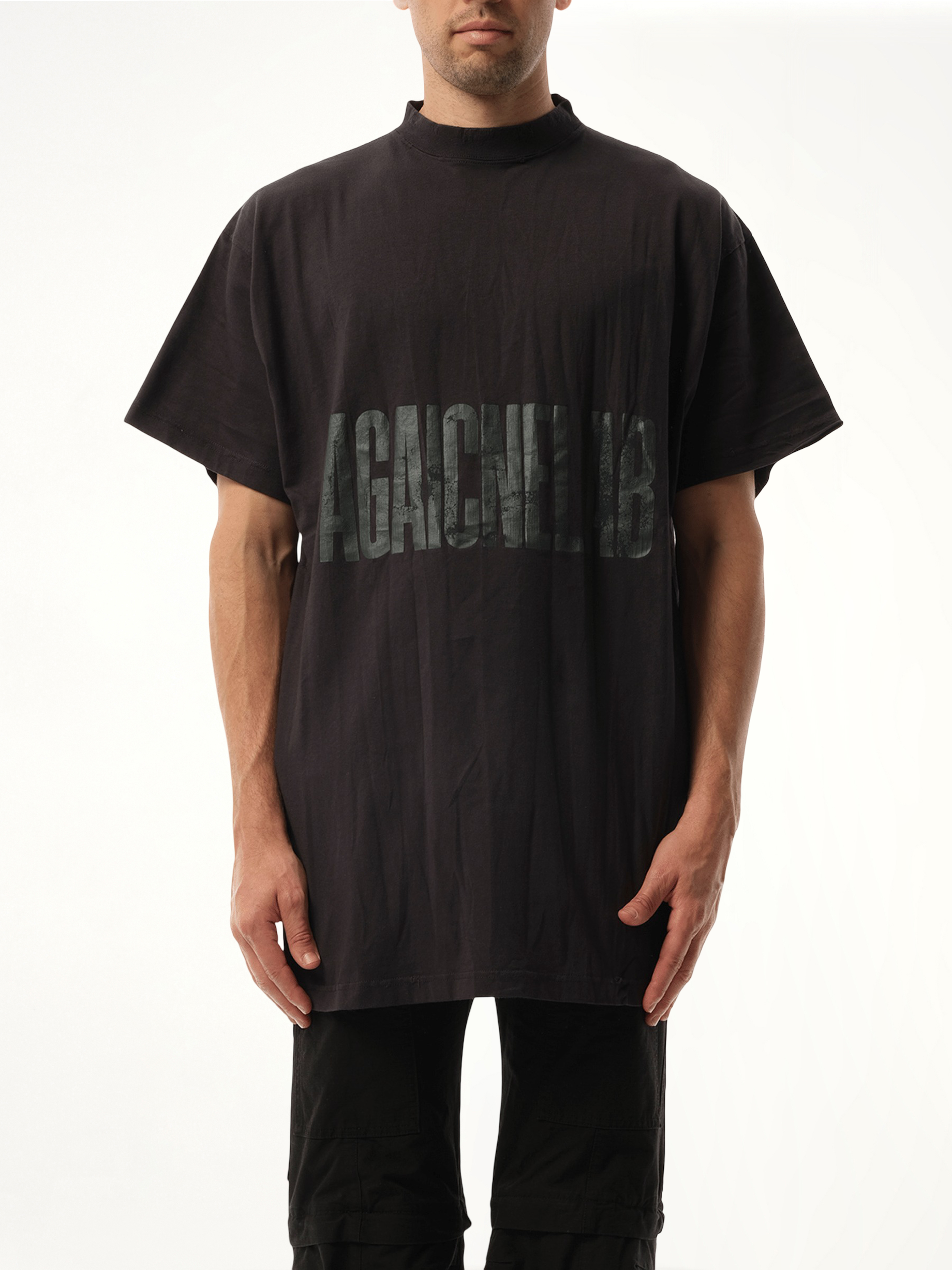 Image of a model wearing Tops. Productname: BALENCIAGA AGAICNELAB Oversized T-Shirt in BLACK colour by brand - BALENCIAGA
