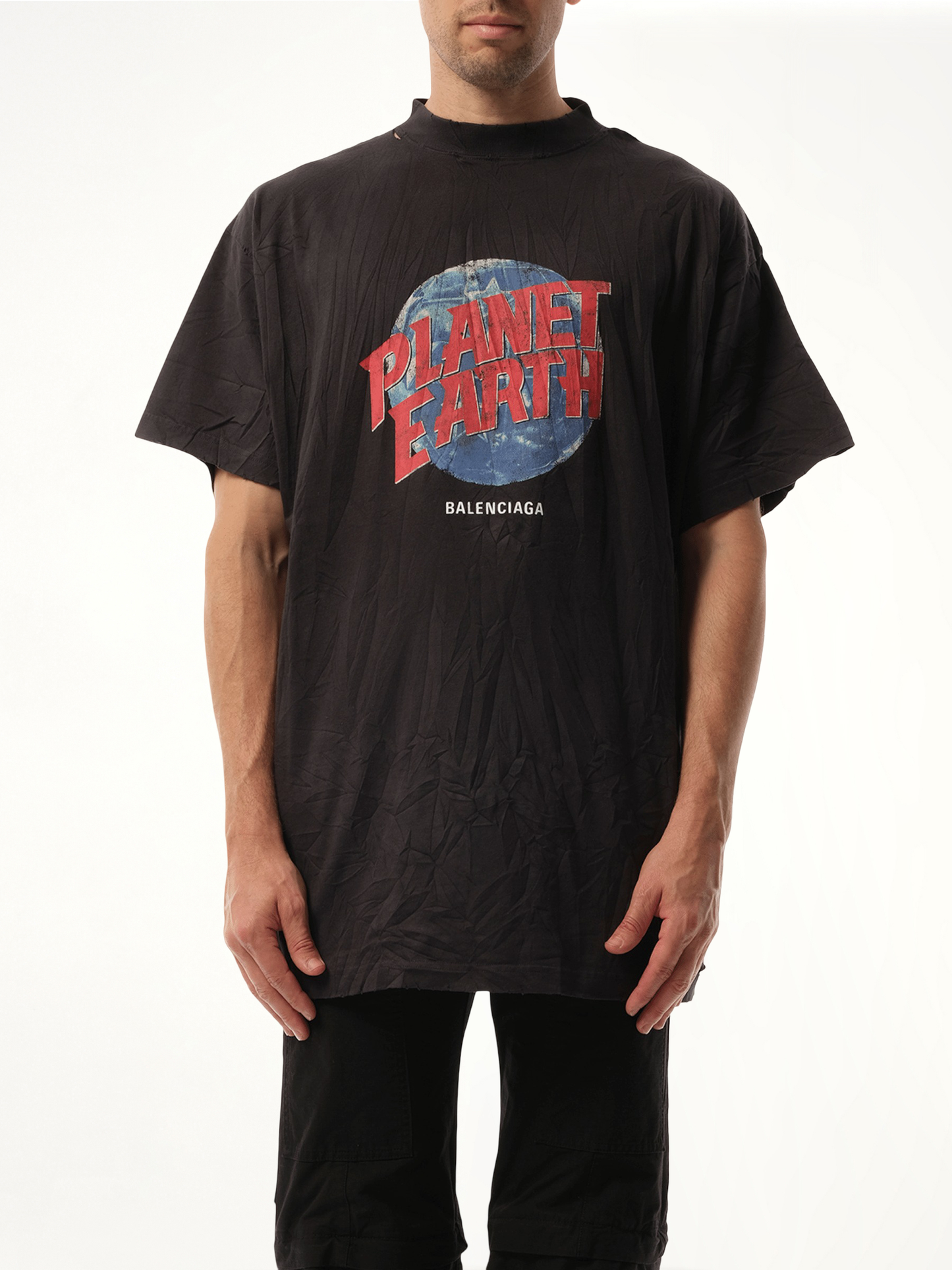 Image of a model wearing Tops. Productname: BALENCIAGA Planet Earth Oversized T-Shirt in BLACK colour by brand - BALENCIAGA