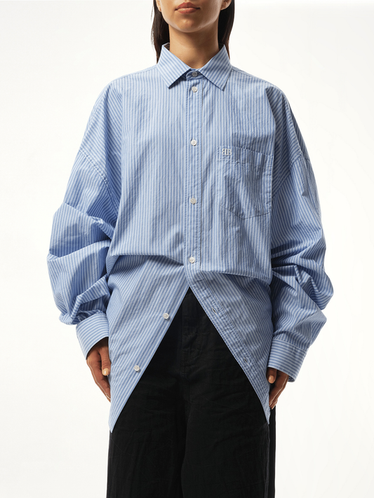 Image of a model wearing Tops. Productname: BALENCIAGA Long Sleeve Knotted Shirt in BLUE colour by brand - BALENCIAGA