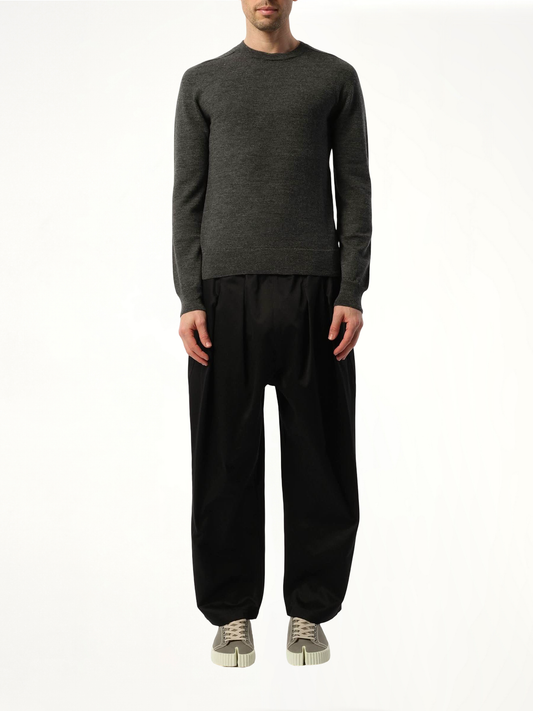 Image of a model wearing Outerwear. Productname: MAISON MARGIELA Elbow Patch Knit Sweater in BLACK colour by brand - MAISON MARGIELA