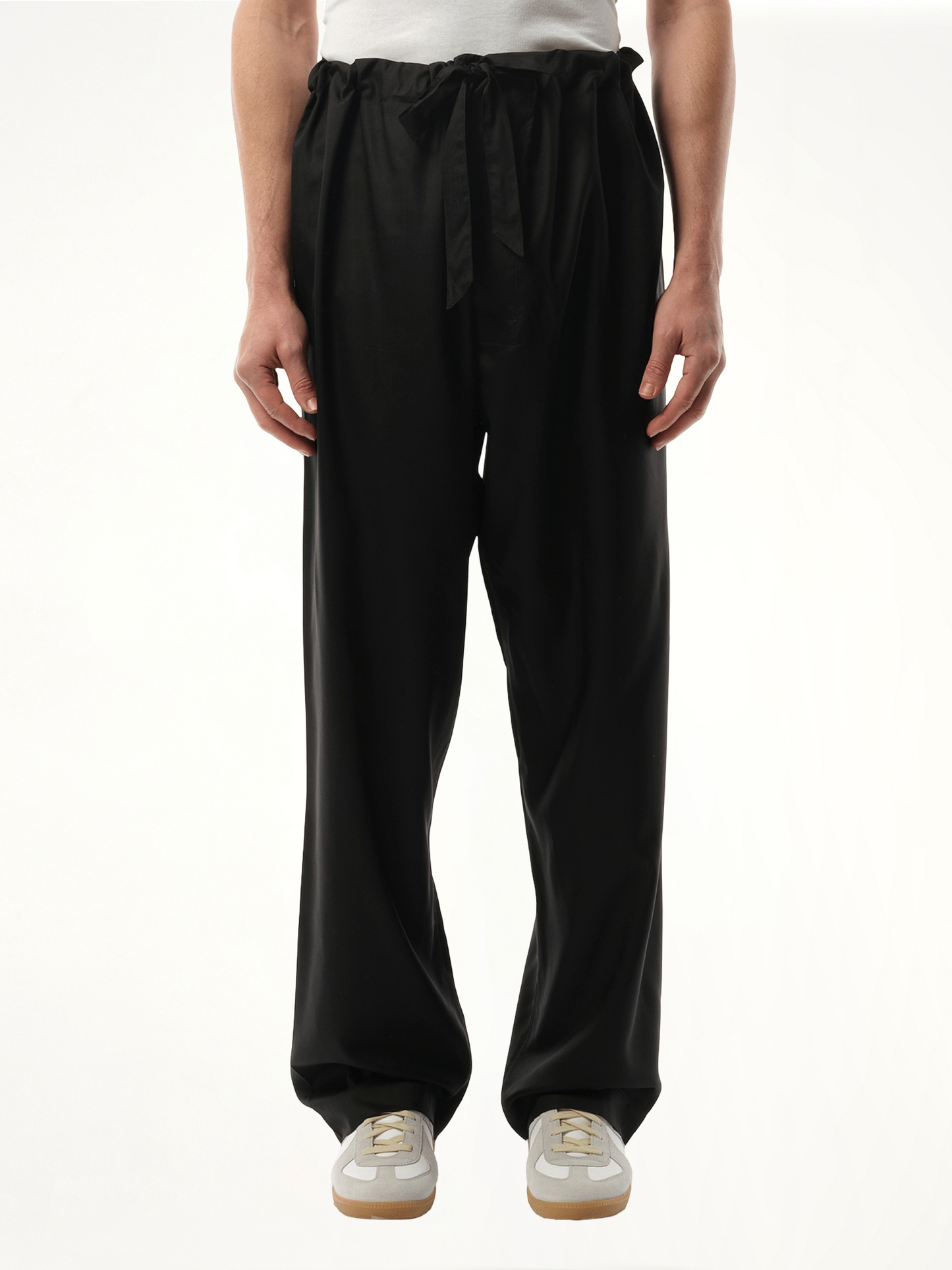 Image of a model wearing Pants. Productname: MAISON MARGIELA Silk Popeline Pants in BLACK colour by brand - MAISON MARGIELA
