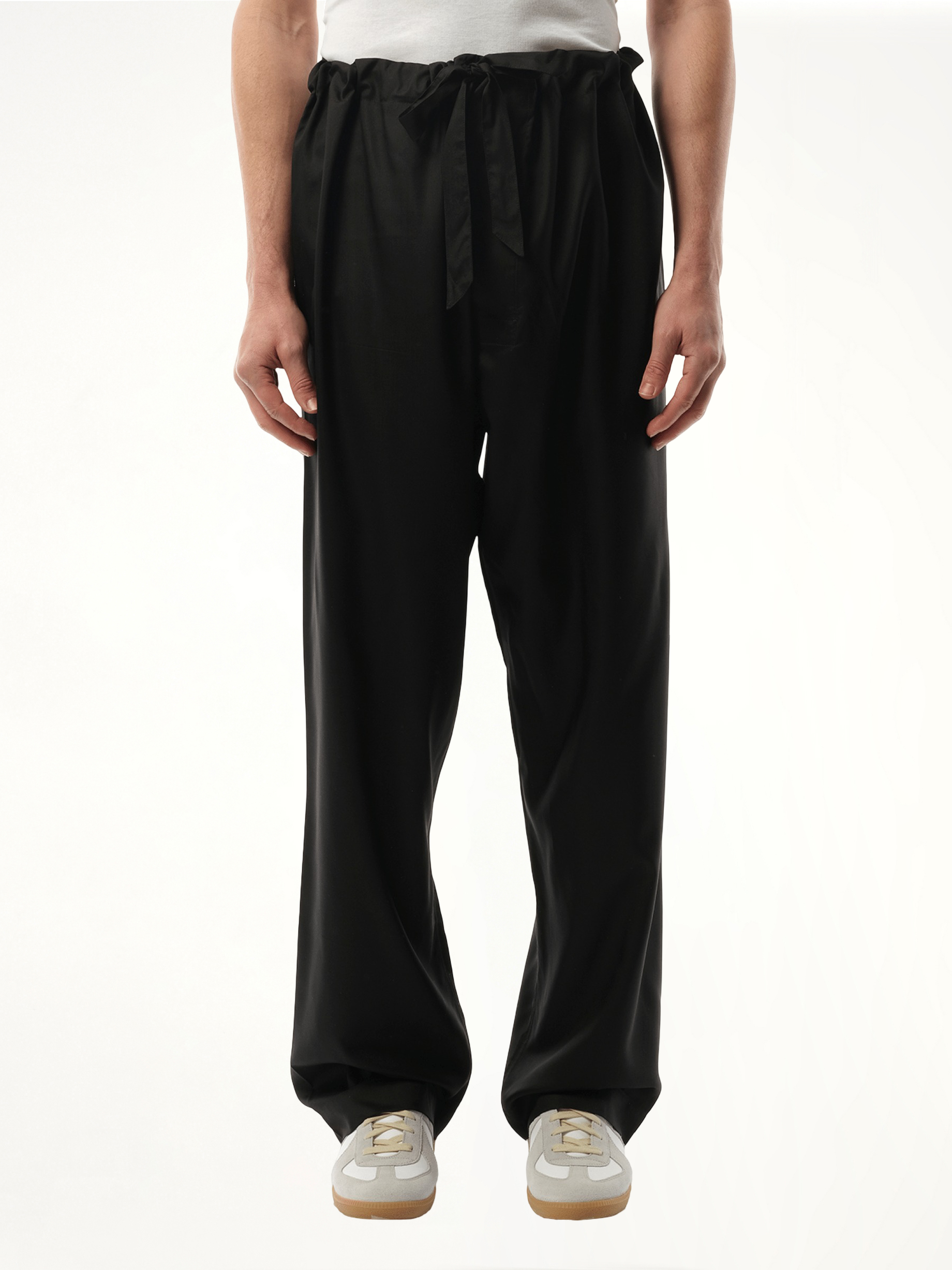 Image of a model wearing Pants. Productname: MAISON MARGIELA Silk Popeline Pants in BLACK colour by brand - MAISON MARGIELA