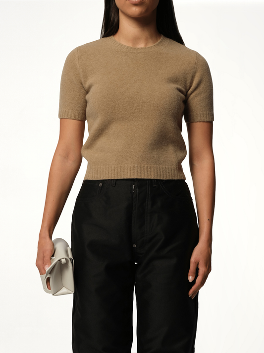 Image of a model wearing Outerwear. Productname: MAISON MARGIELA Lambswool Short Sleeve Sweater in BEIGE colour by brand - MAISON MARGIELA