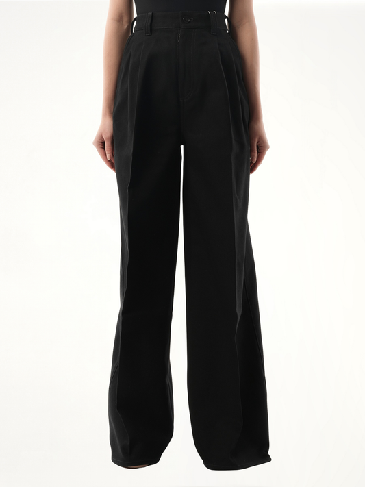 Image of a model wearing Pants. Product name - Heavy Cotton Wide Pants in Black colour by brand - MAISON MARGIELA