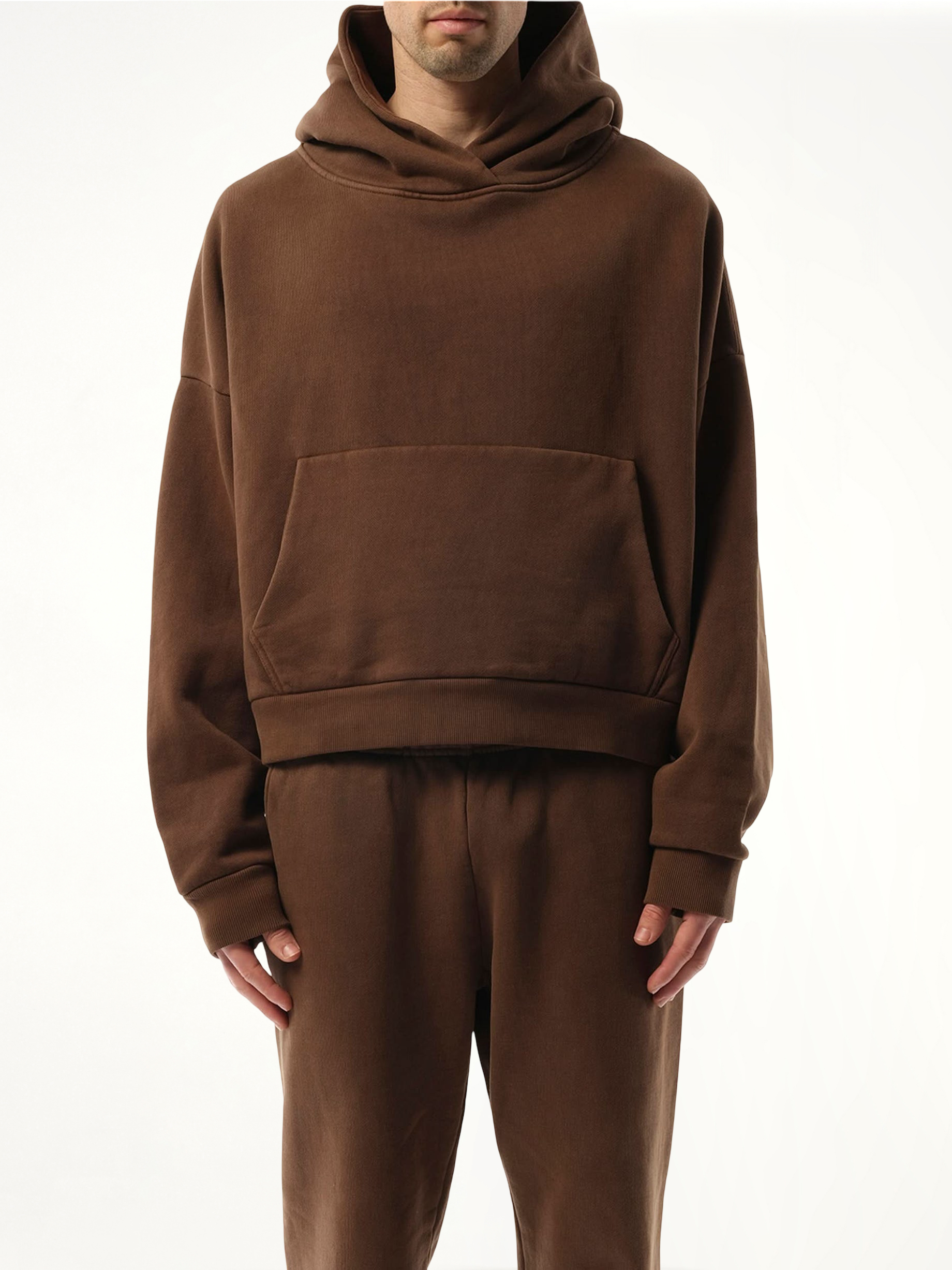 Image of a model wearing Outerwear. Product name - Heavy Hood in Brown colour by brand - ENTIRE STUDIOS