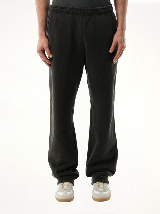 Image of a model wearing Pants. Product name - Straight-Leg Sweatpants in Black colour by brand - ENTIRE STUDIOS