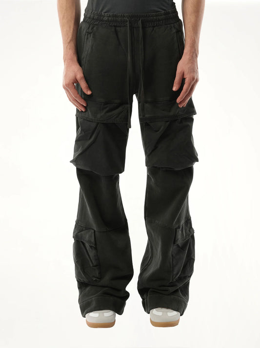 Image of a model wearing Pants. Product name - Utility Sweatpants in Black colour by brand - ENTIRE STUDIOS
