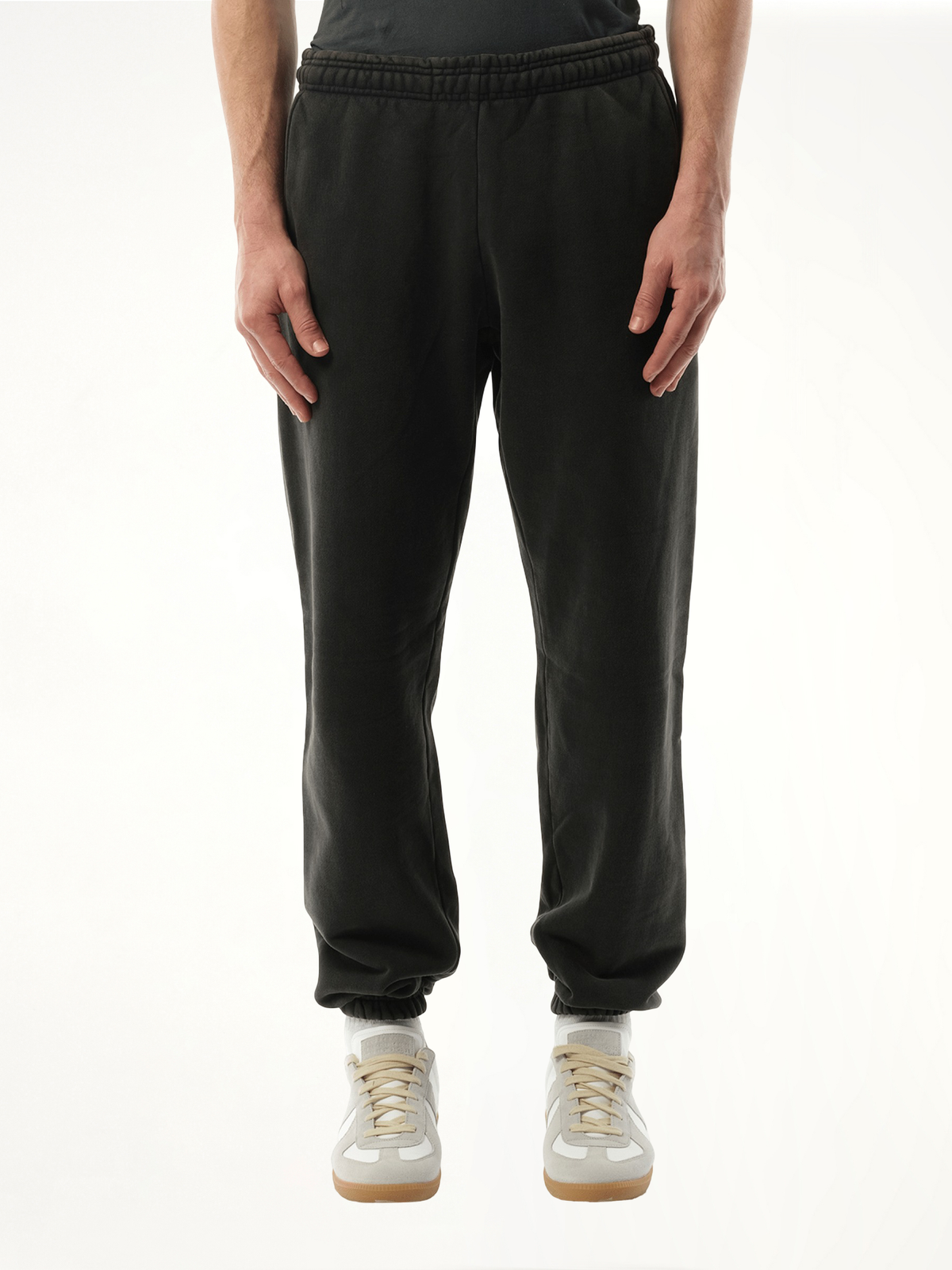 Image of a model wearing Pants. Product name - Heavy Sweatpants in Black colour by brand - ENTIRE STUDIOS