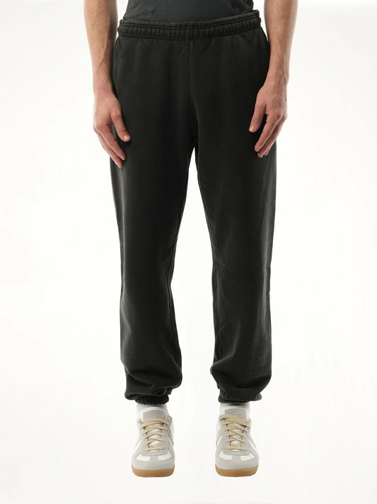 Image of a model wearing Pants. Product name - Heavy Sweatpants in Black colour by brand - ENTIRE STUDIOS