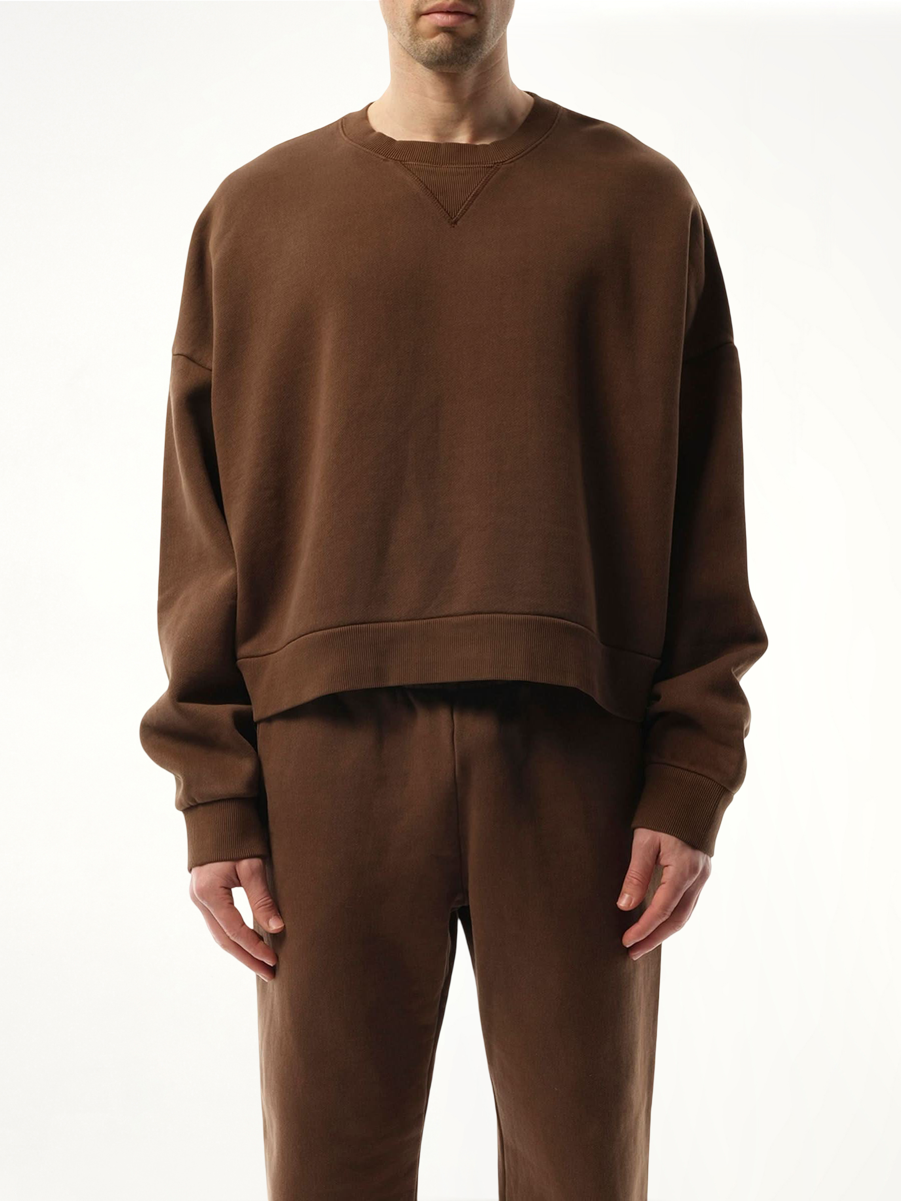 Image of a model wearing Outerwear. Product name - Box Sweatshirt in Brown colour by brand - ENTIRE STUDIOS