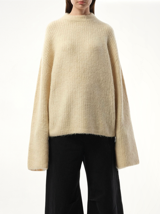 Image of a model wearing Outerwear. Productname: ENTIRE STUDIOS Heavy Knit Sweater in BEIGE colour by brand - ENTIRE STUDIOS